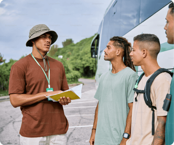 A local guide showing something to travelers